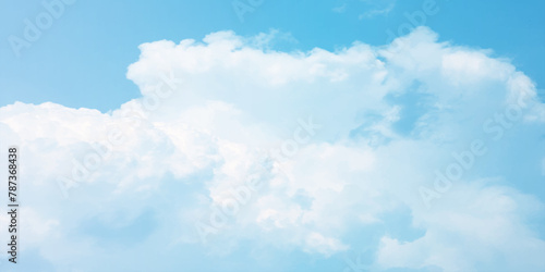 It's a hot day with the sun shining down on a blue sky filled with alternating small and huge clouds moving gently while the light from the sky creates a remarkable abstract shape. Horizon, Cloud Back