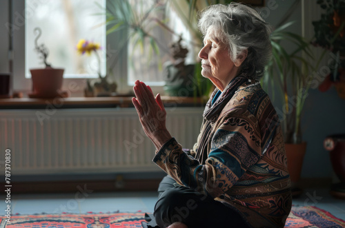 elderly woman is practicing yoga meditation
