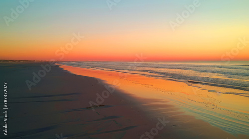 Vivid sunset sky painted in orange and pink over the beach  creating a breathtaking coastal evening scene