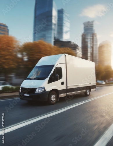 Delivery van in motion. Delivery car in its way. Cargo van driving. Blurred city streets in background photo
