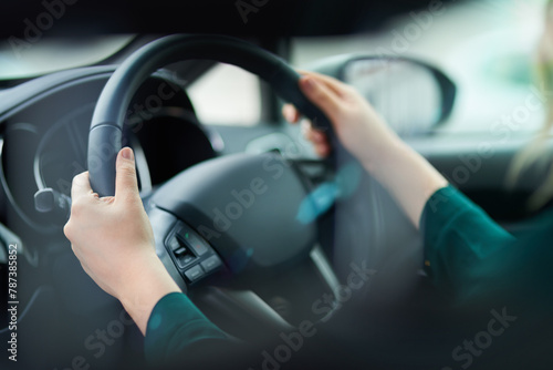 Hands, travel and driving car with steering wheel for vacation, holiday or trip in motor vehicle. Closeup, dashboard and person in transport on journey for adventure, commute or speed in automobile © peopleimages.com