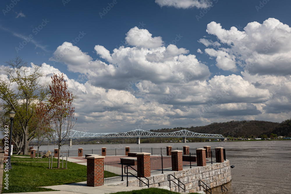 A view from Madison, Indiana riverside park on the bank of Ohio river towards bridge towards Milton, Kentucky A view from Madison, Indiana riverside park on the bank of Ohio river towards bridge towards Milton, Kentucky
