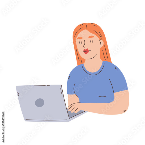 Redhead girl typing on a laptop