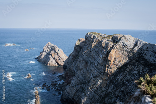 Tranquil shores of Cabo de Peñas, an unspoiled gem for adventurous tourists.