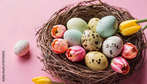 A birds nest filled with eggs sits beside vibrant tulips on a pink background