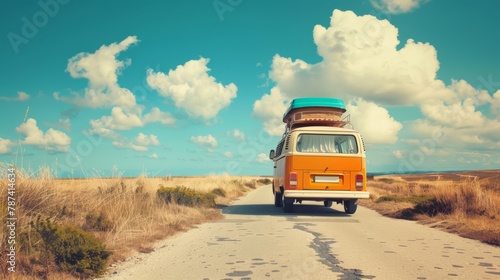 Red vintage van with luggage driving on mountainous road overlooking the sea.