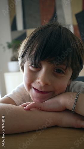 Happy little boy looking at camera, portrait close-up face of 5 year old caucasian child with handsome expression