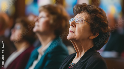Woman in contemplation looks upwards inside a church, captured in a moment of reflection and spirituality.