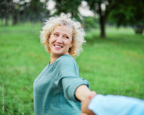 woman man couple happy together mature active bonding love outdoor walking leisure park fun smiling park old nature wife happiness senior lifestyle people retirement mid middle aged adult vitality