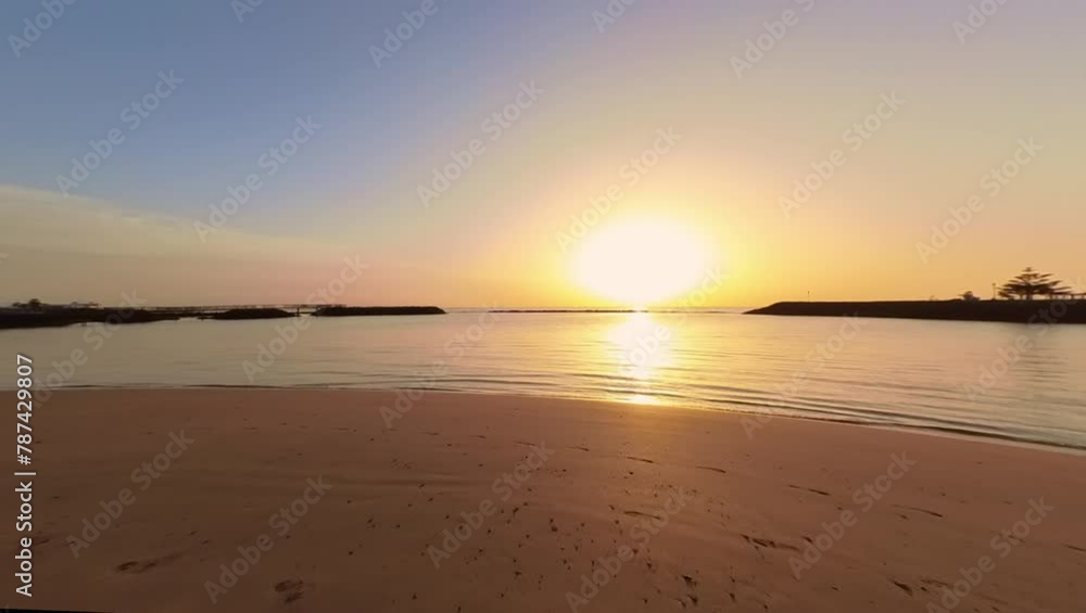 Wide panorama of a beautiful sunset at the beach in Risco del Paso on the Atlantic Ocean coast in Fuerteventura
