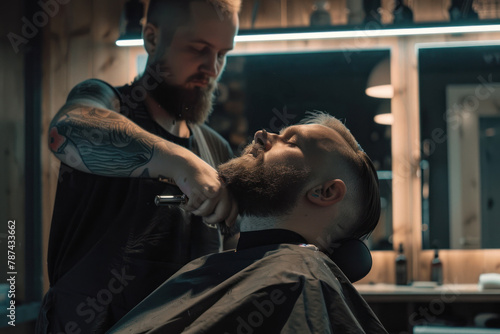 A tattooed barber carefully trims the hair of a client using professional barber tools in a hip setting