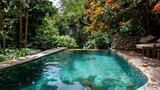 A tranquil scene depicting a crystal-clear pool bordered by a rich tapestry of tropical plants and sun-kissed poolside, creating an intimate hideaway