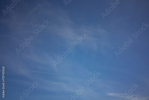 Serenity in the Sky: Blue Sky with Light, Wispy Clouds