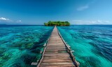 Beautiful wooden bridge leading to a small island in the transparent turquoise sea water on a sunny summer morning