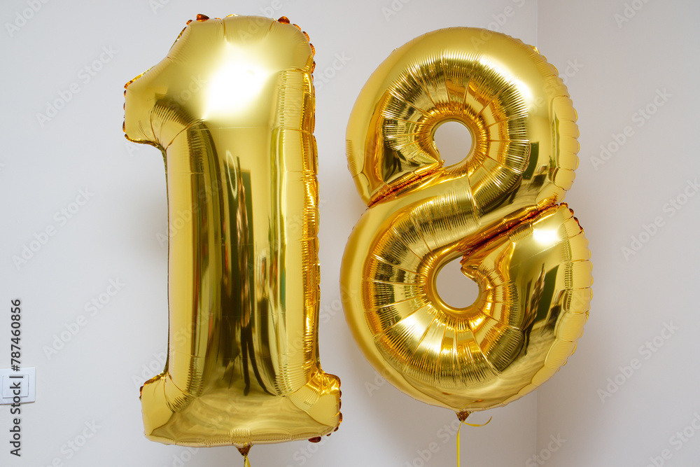Fototapeta premium golden balloons number 18 on white background