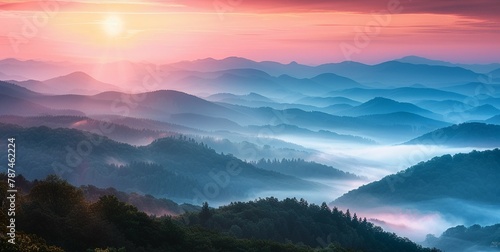 A breathtaking sunrise over a misty mountain range, with layers of hills fading into the distance, embodying peace and natural beauty