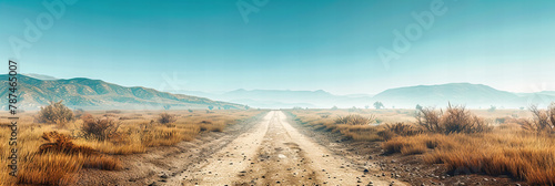 Remote Desert Road Extending to the Horizon, Dry Mountainous Landscape Under Blue Skies, Adventure Journey