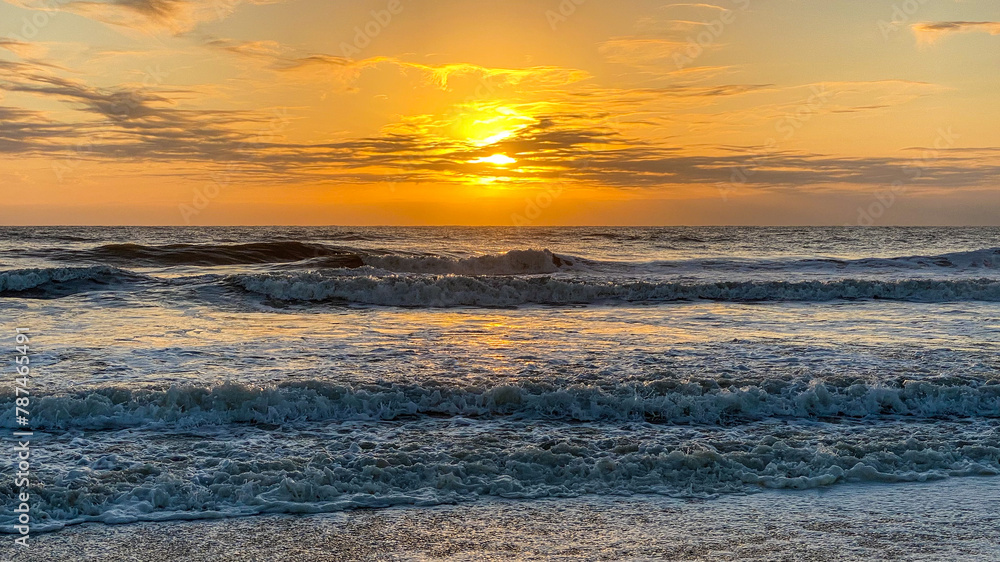 Orange Sunrise over Ocean Waves on American Beach in Amelia Island Florida