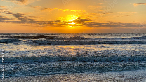 Orange Sunrise over Ocean Waves on American Beach in Amelia Island Florida
