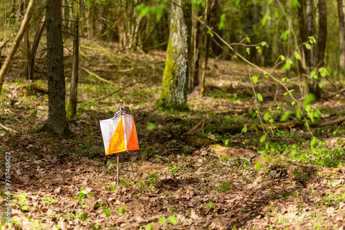 Orienteering. Control point Prism and electric composter for orienteering in the spring forest.