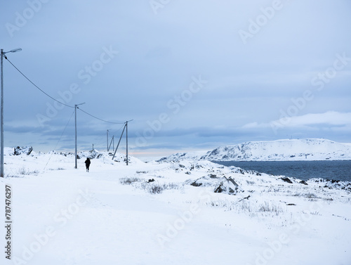 snow covered seaside shore in Vardo, Norway © Agata Kadar