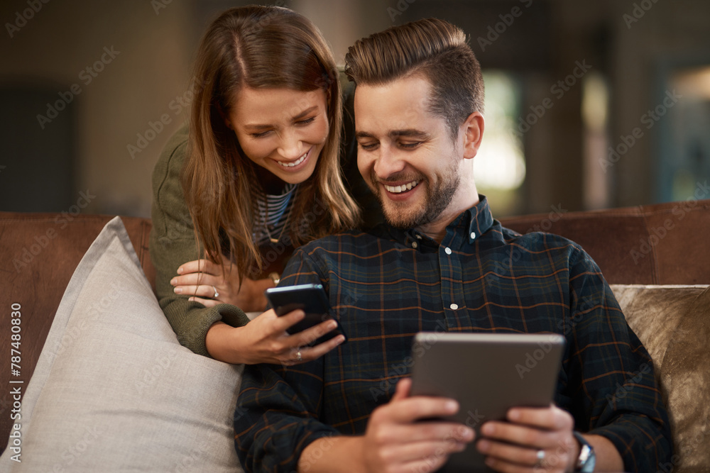 Happy, sofa and couple with phone and tablet for social media meme, internet joke and show videos. Home, living room and man and woman on technology for website, connection and online chat on weekend Happy, sofa and couple with phone and tablet for social media meme, internet joke and show videos. Home, living room and man and woman on technology for website, connection and online chat on weekend