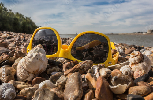 sunglasses on a sunny beach photo