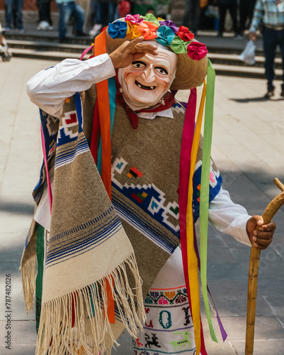 Danza de los viejitos, traditional Mexican dance originating from the state of Michoacan, Mexico. With colorful and lively colors, in addition to his typical old man's mask. photo