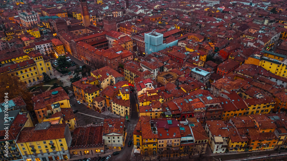 Fototapeta premium Aerial view of Verona at sunset, Veneto region, Italia. Red tiled roofs. Traditional Italian architecture