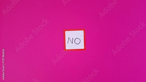 No. Text negative answer or decision, disagreement, rejection, refusal or contradiction. No is written and disappears on Sticky note. photo