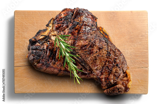 Fiorentina T-bone steak cut on rectangular wooden chopping board