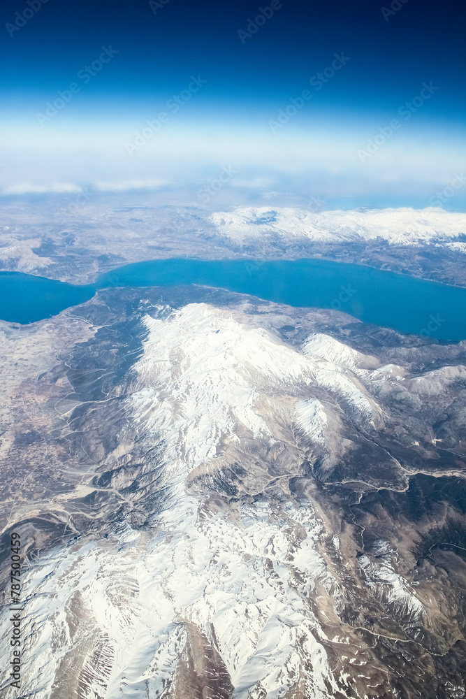 Obraz premium Beautiful earth and sea from a window airplane background