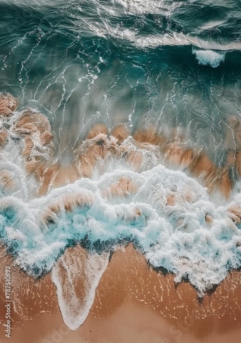 Aerial View of Ocean Waves and Sand