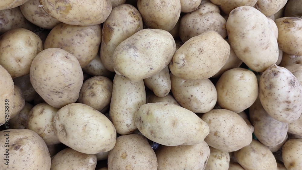 a lot of potatoes in the grocery store. a lot of potatoes in the grocery store.