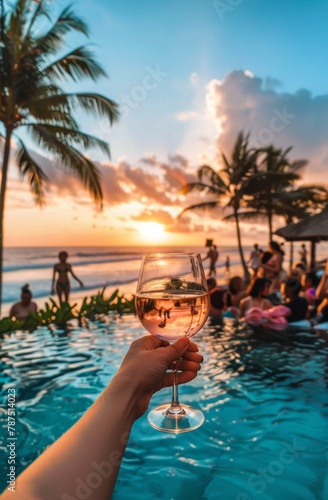 Person Holding Glass of Wine by Swimming Pool