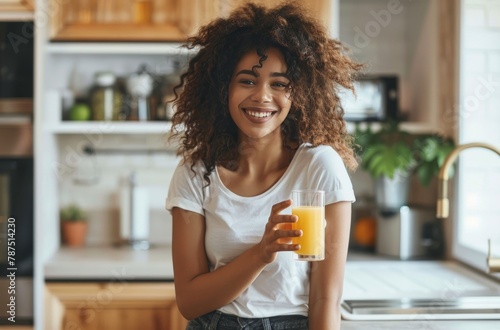 Woman Holding a Glass of Orange Juice