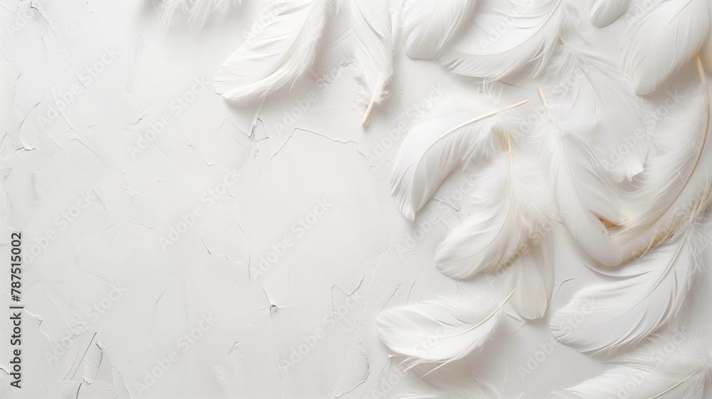 Fototapeta premium Scattered white feathers on a white surface. Top view. Copy space.