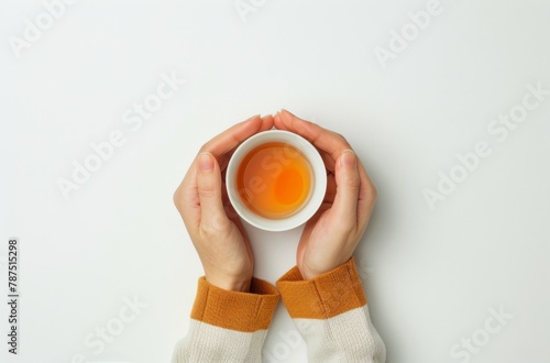 Person Holding Cup of Tea