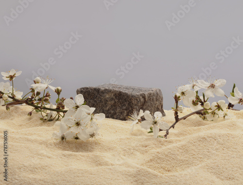 Stack of stones, flower platform podium on beige sand background. Minimal empty display product presentation scene.
