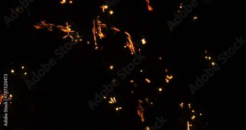 Glowing flashes, explosions passing through thin threads on a black background. Pulse flashes.