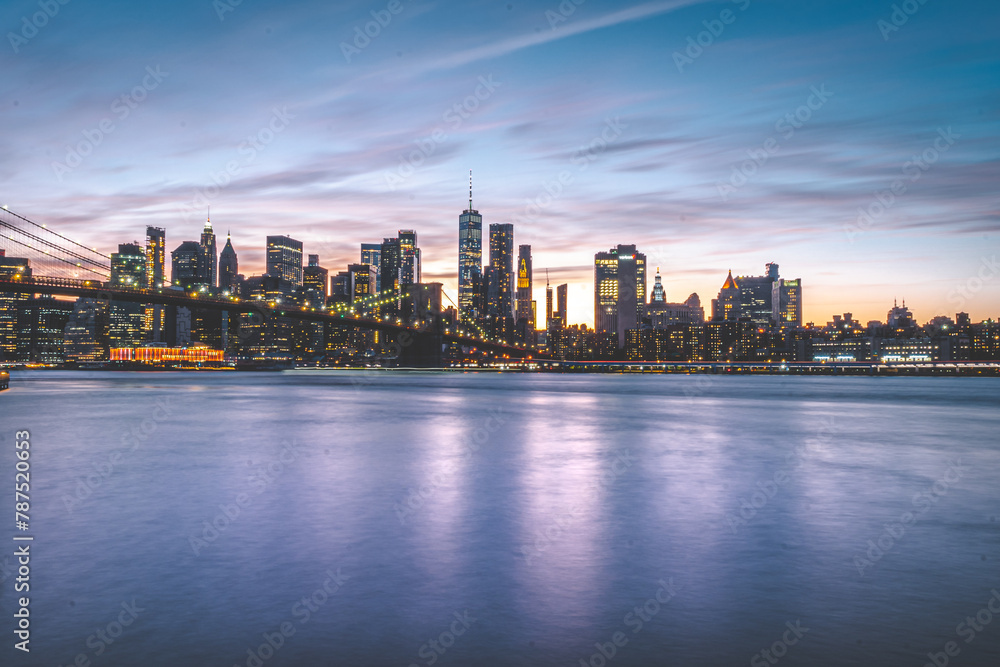 A night view of the Manhattan skyline in New York City. A night view of the Manhattan skyline in New York City.