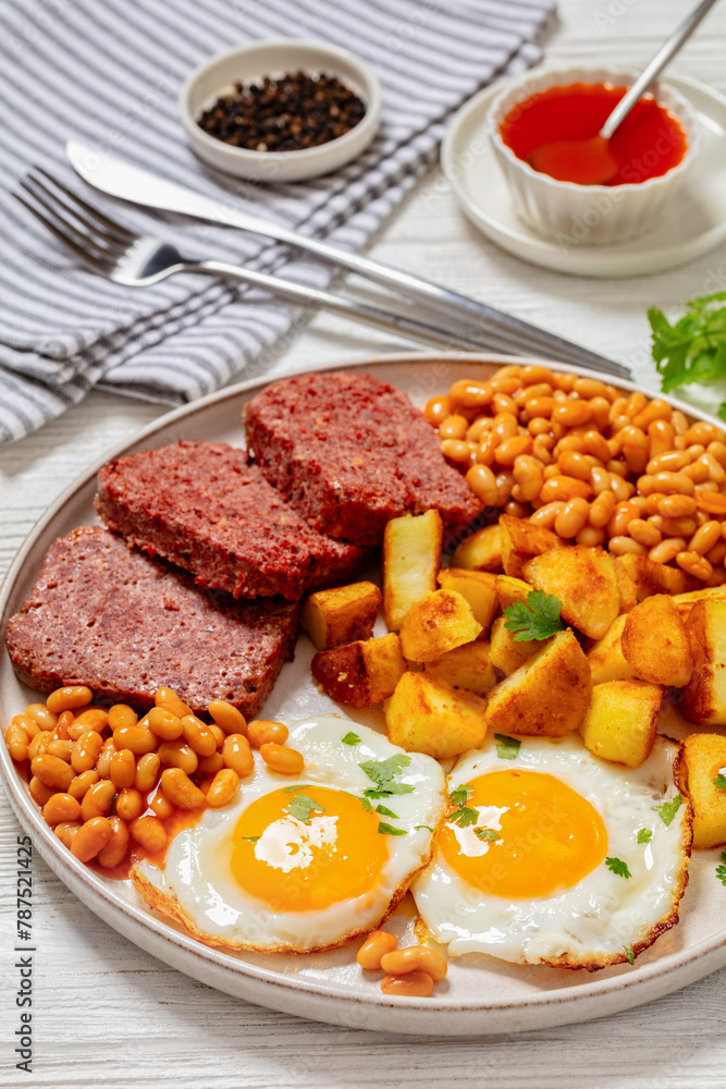 corned beef, baked beans, potatoes and fried eggs corned beef, baked beans, potatoes and fried eggs