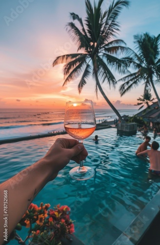Person Holding Glass of Wine by Swimming Pool