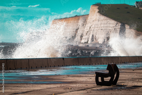bench next to the seaside with white cliffs 