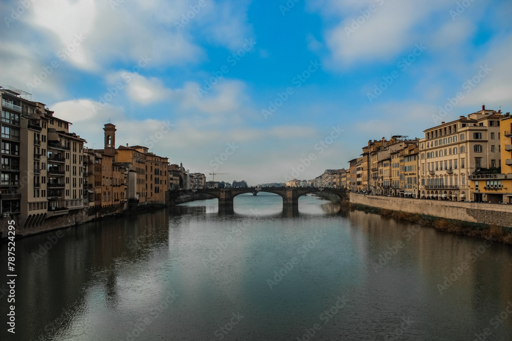 bridge over arno in florence, with buildings around on the banks