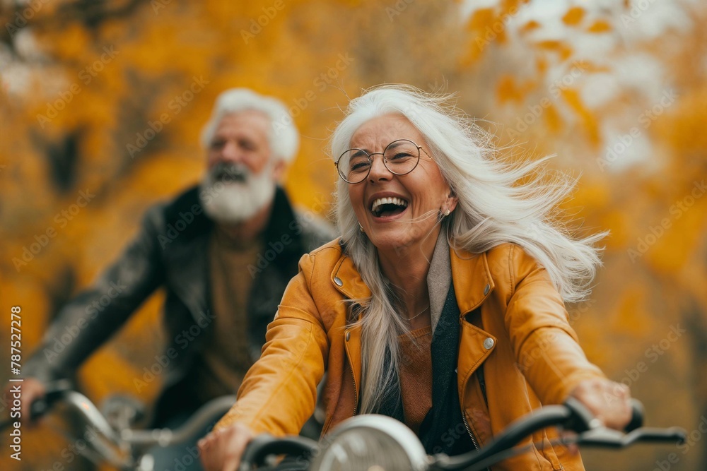 Joyful Elderly Couple on a Bike Ride in Autumn Park, Radiating Happiness and Vitality