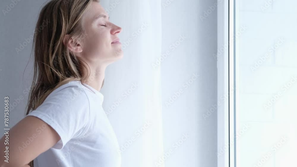 morning routines. Woman Standing By Bedroom Window And Opening Curtains morning routines. Woman Standing By Bedroom Window And Opening Curtains