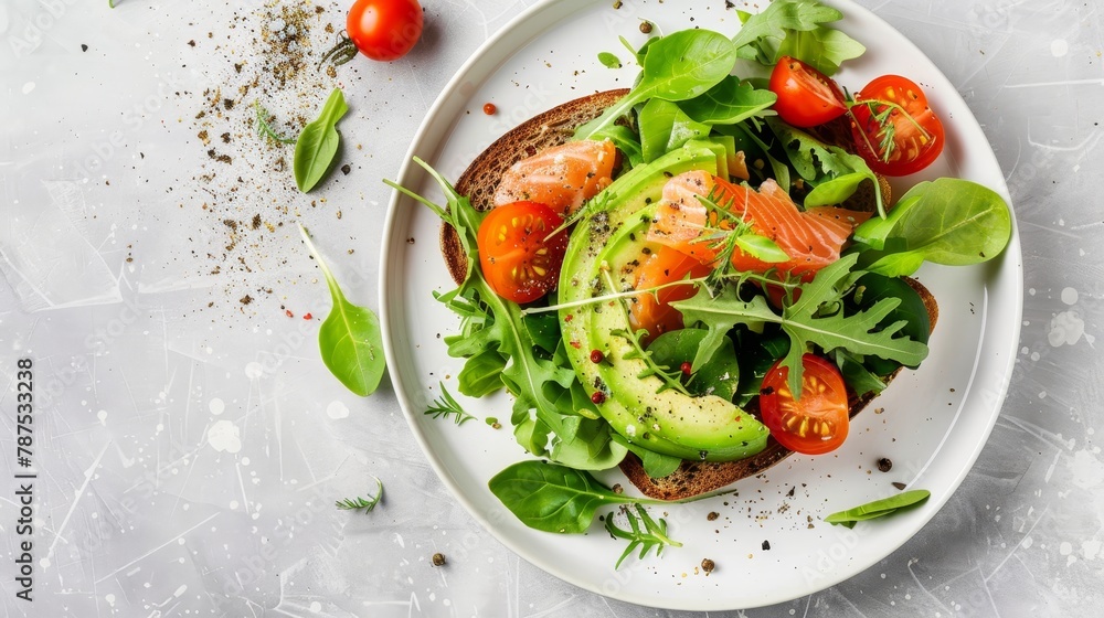 Avocado toast with salmon and fresh greens on white plate, top view for elegant presentation Avocado toast with salmon and fresh greens on white plate, top view for elegant presentation