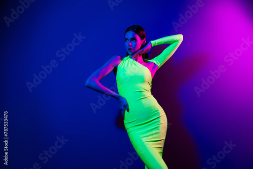 Photo of fancy pretty model girl arm touch face look empty space isolated on purple neon background