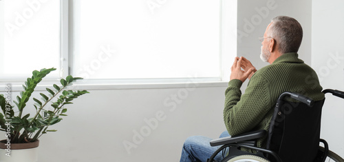 Senior man in wheelchair at...